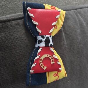 Disney Jessie Toy Story Red and Yellow Hair Bow with Horseshoe Accent